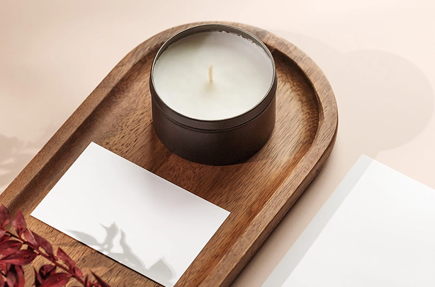 Candle on a decorative wooden tray